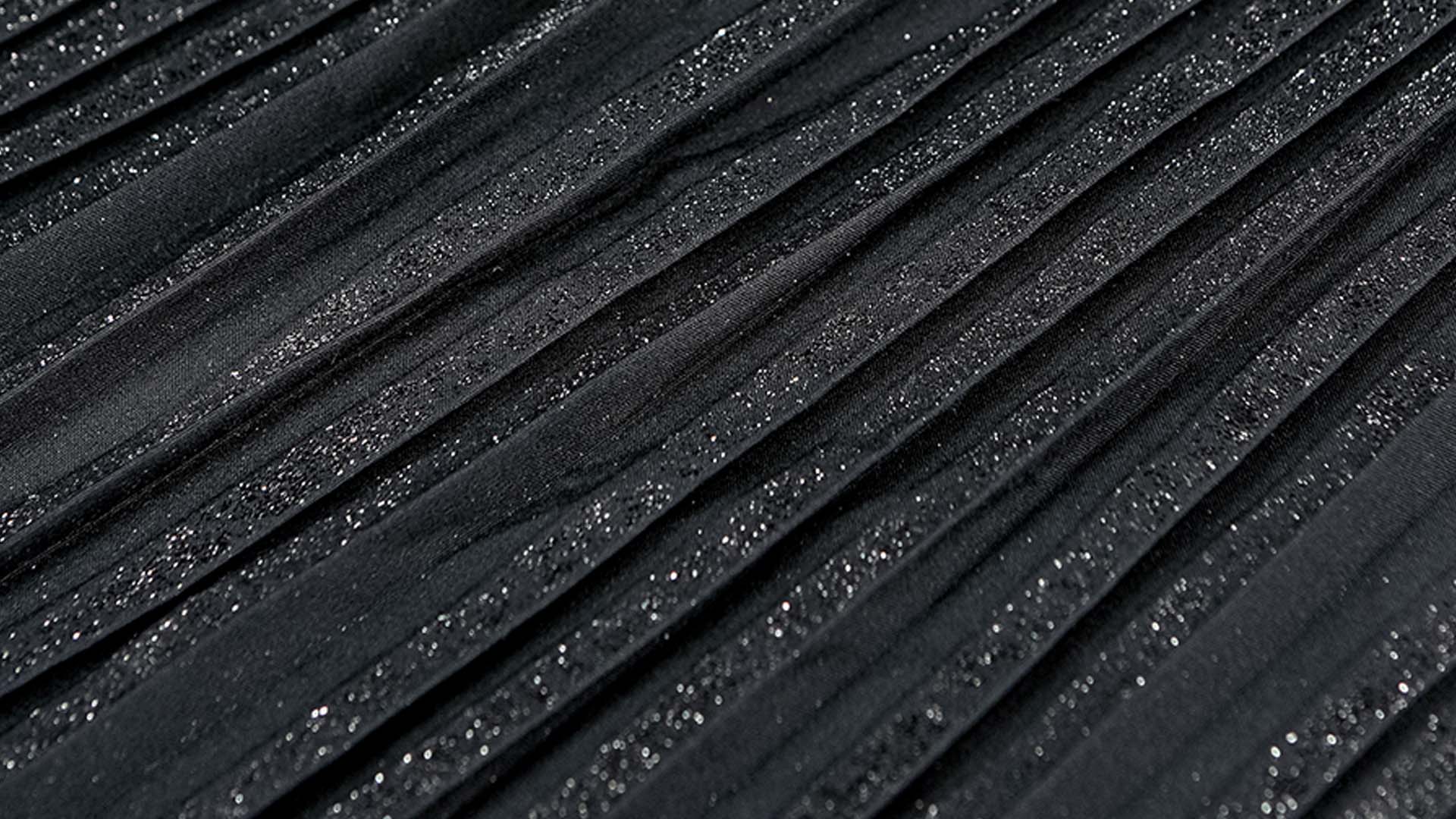 Tecido preto plissado